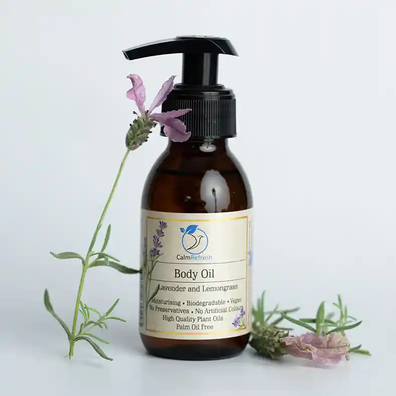 Lavender and Lemongrass Body Oil with Spanish Lavender leaning on bottle and one on other side