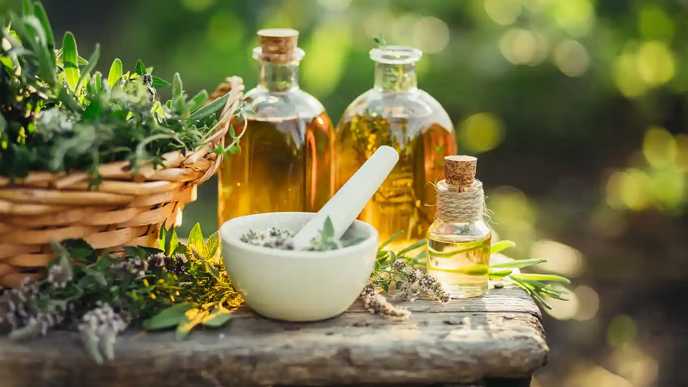 Mortar and pestle with herbs and oils