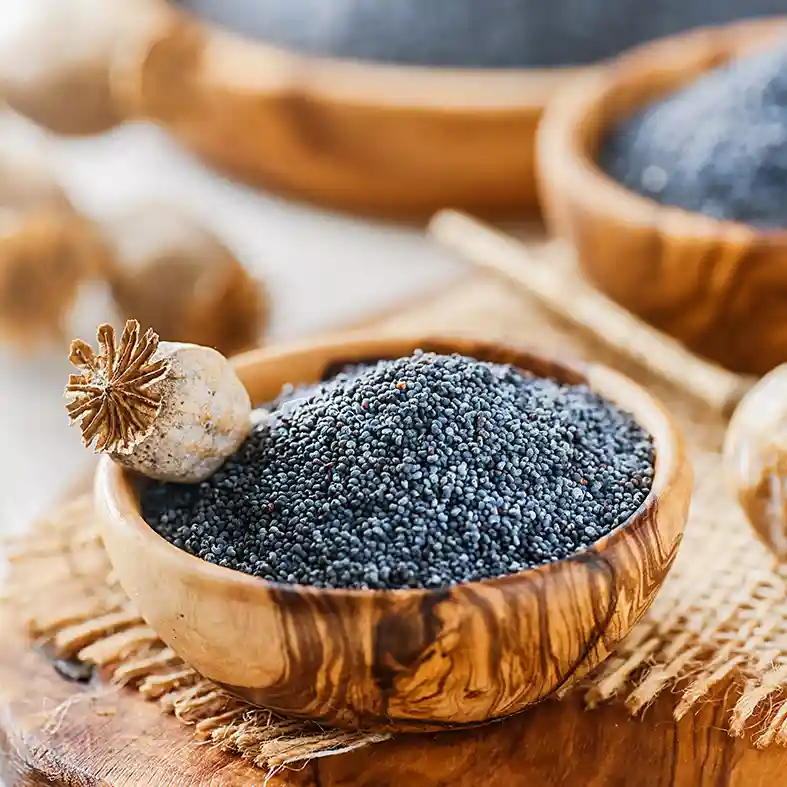 Poppy seeds in wooden bowls